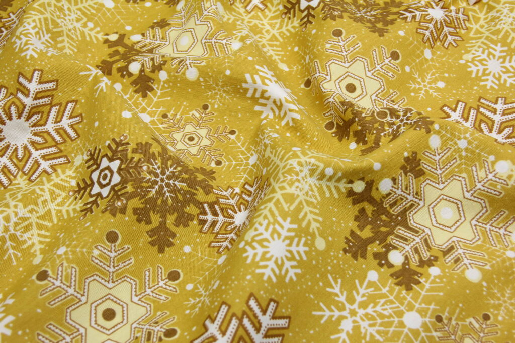 Ткань скатертная с тефлоновой пропиткой Танец снежинок Охра
