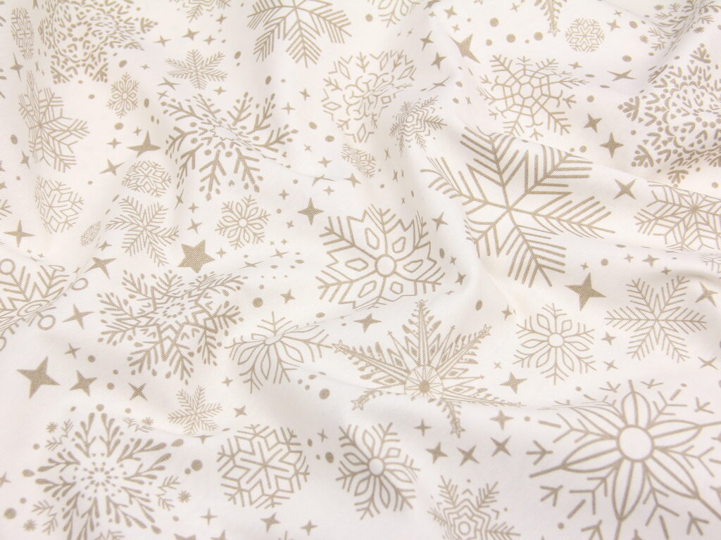 Тканина скатертна з тефлоновим просоченням Сніжинки чарівні Бронза на молочному