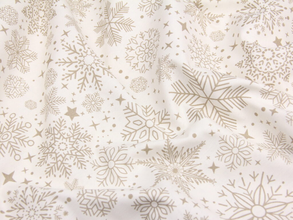 Тканина скатертна з тефлоновим просоченням Сніжинки чарівні Бронза на молочному